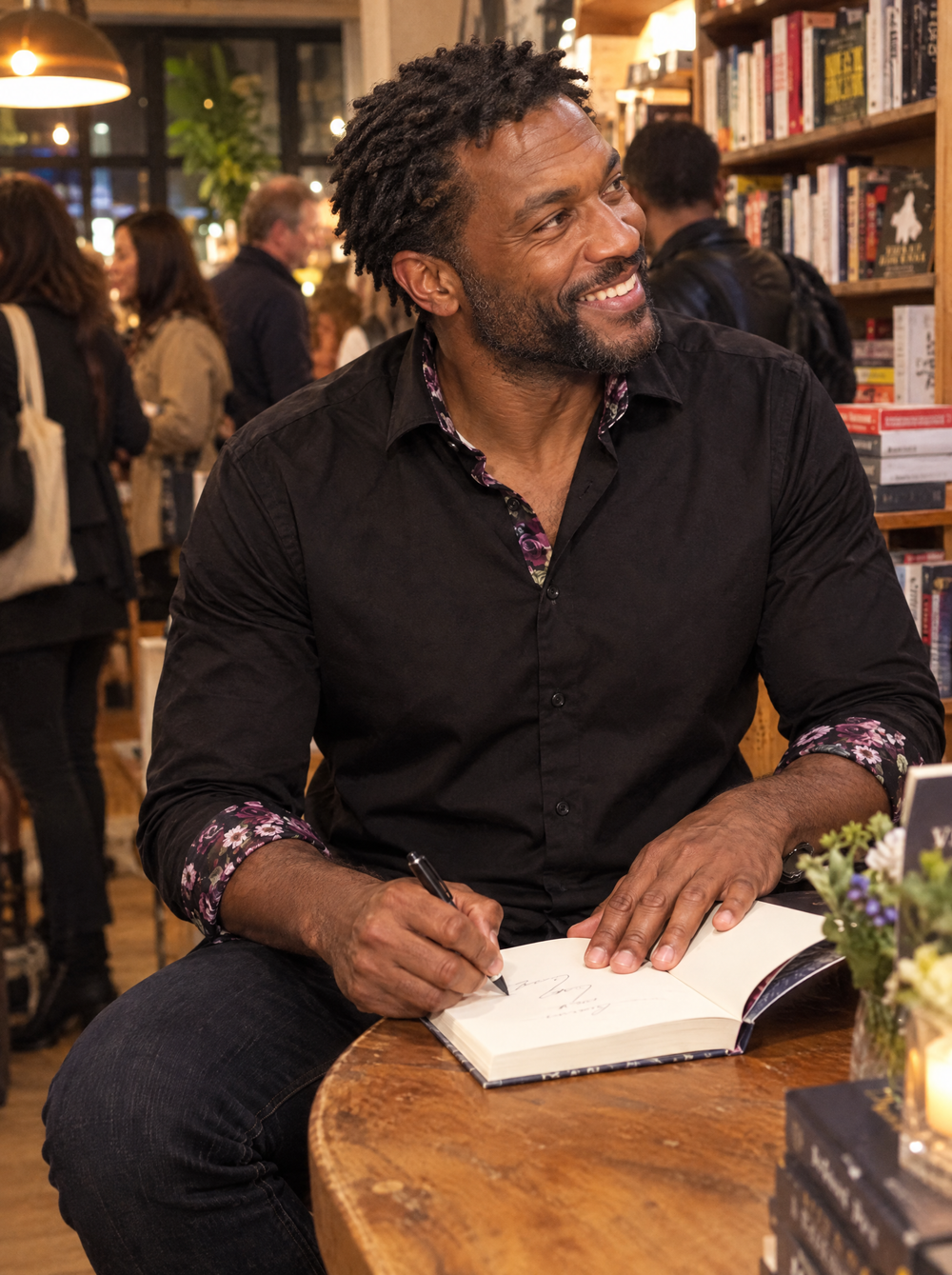 Man wearing the Black Sateen Shirt with Name of the Rose Accents at a book launch
