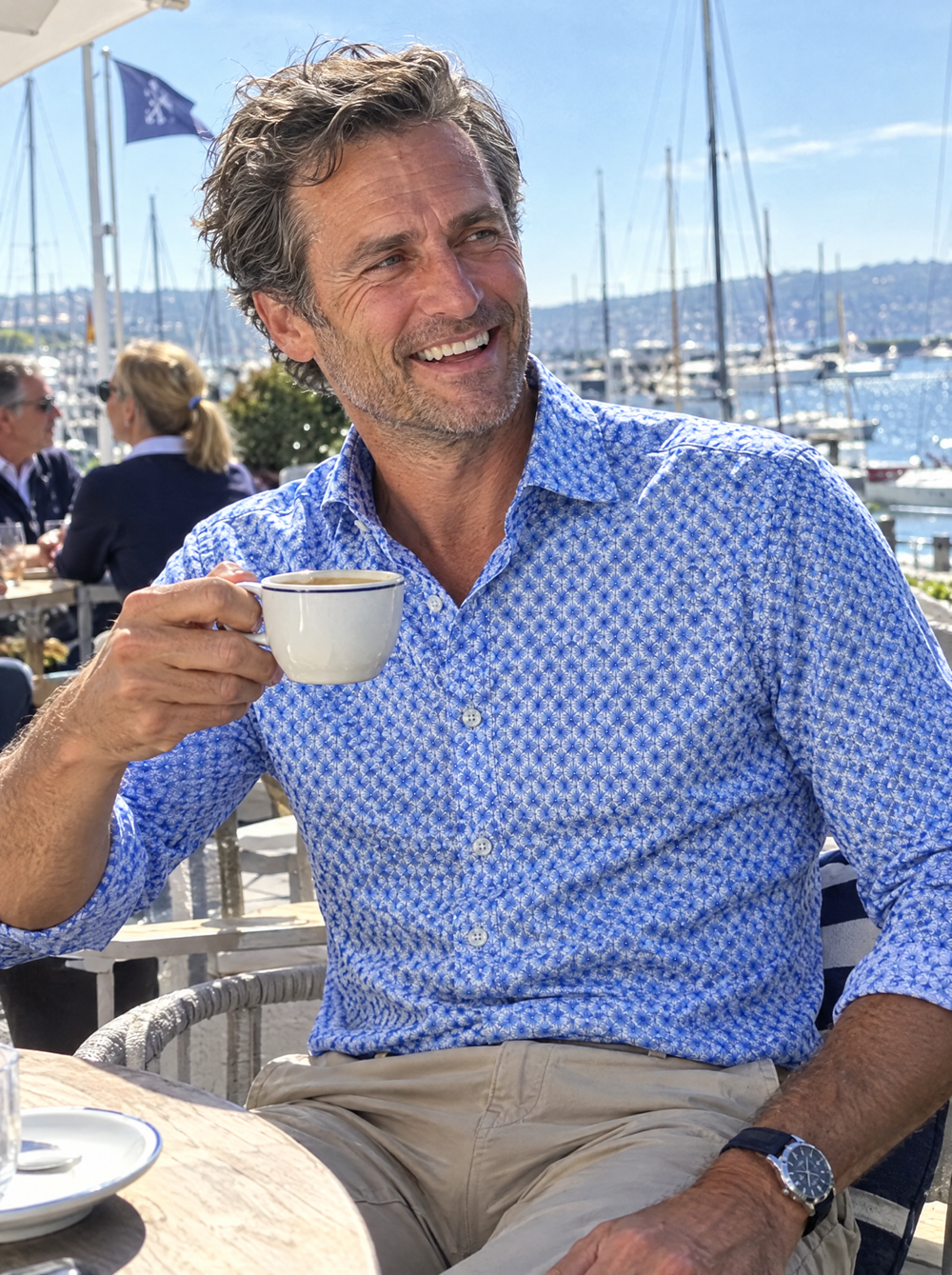 Man wearing the Blue Wavy Geo shirt at a yacht club