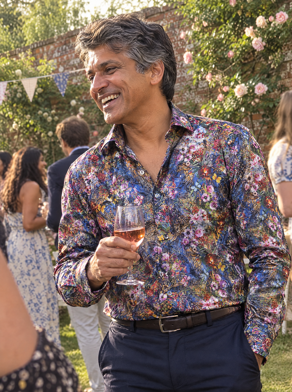 Man wearing the Botanical Gardens shirt at a garden party