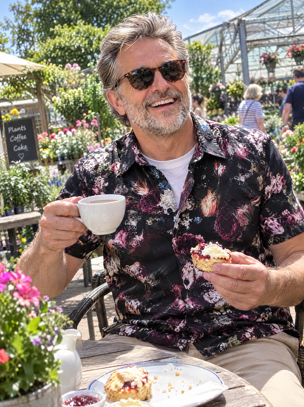 Man wearing the Dark Bloom Short Sleeve shirt at a garden centre café