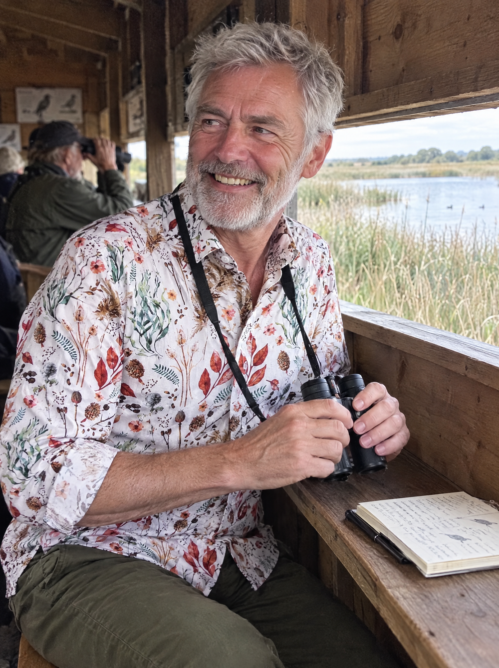 Man wearing the Field Notes shirt in a bird hide