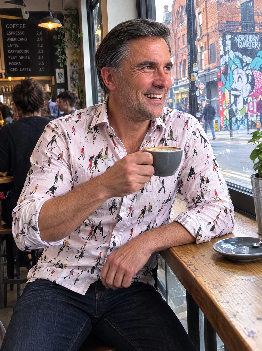 Man wearing the Lowry: Going To Work (Pink) shirt in a Northern Quarter coffee shop