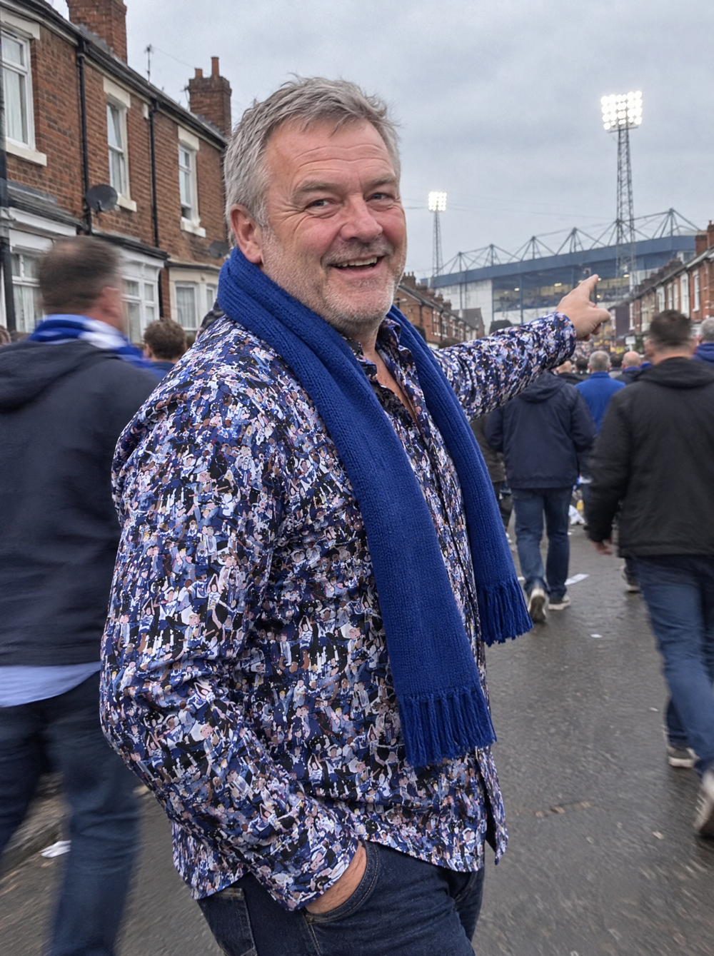 Man wearing the Matchday (Blue) Shirt walking to the football ground