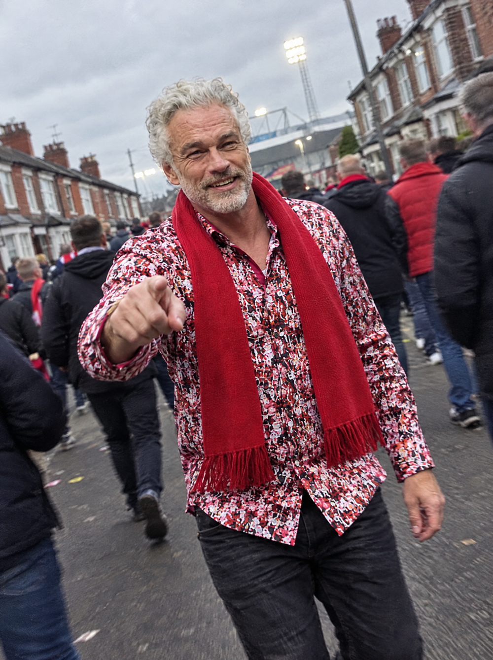 Man wearing the Matchday (Red) shirt walking to the football