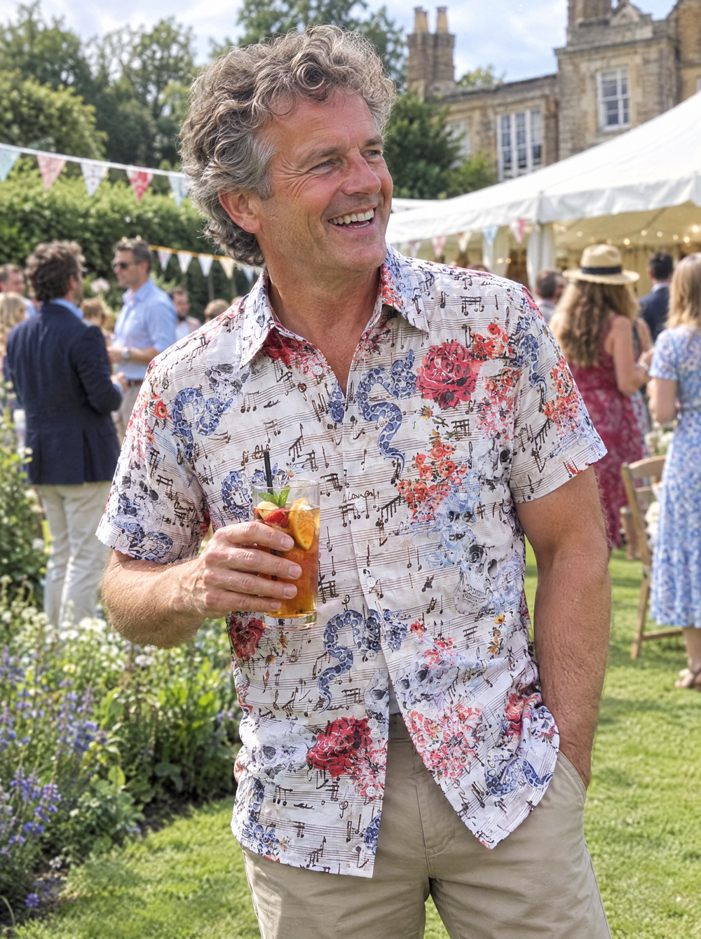 Man wearing the Vanitas Sonata (Cream) Short Sleeve Shirt at a summer garden party