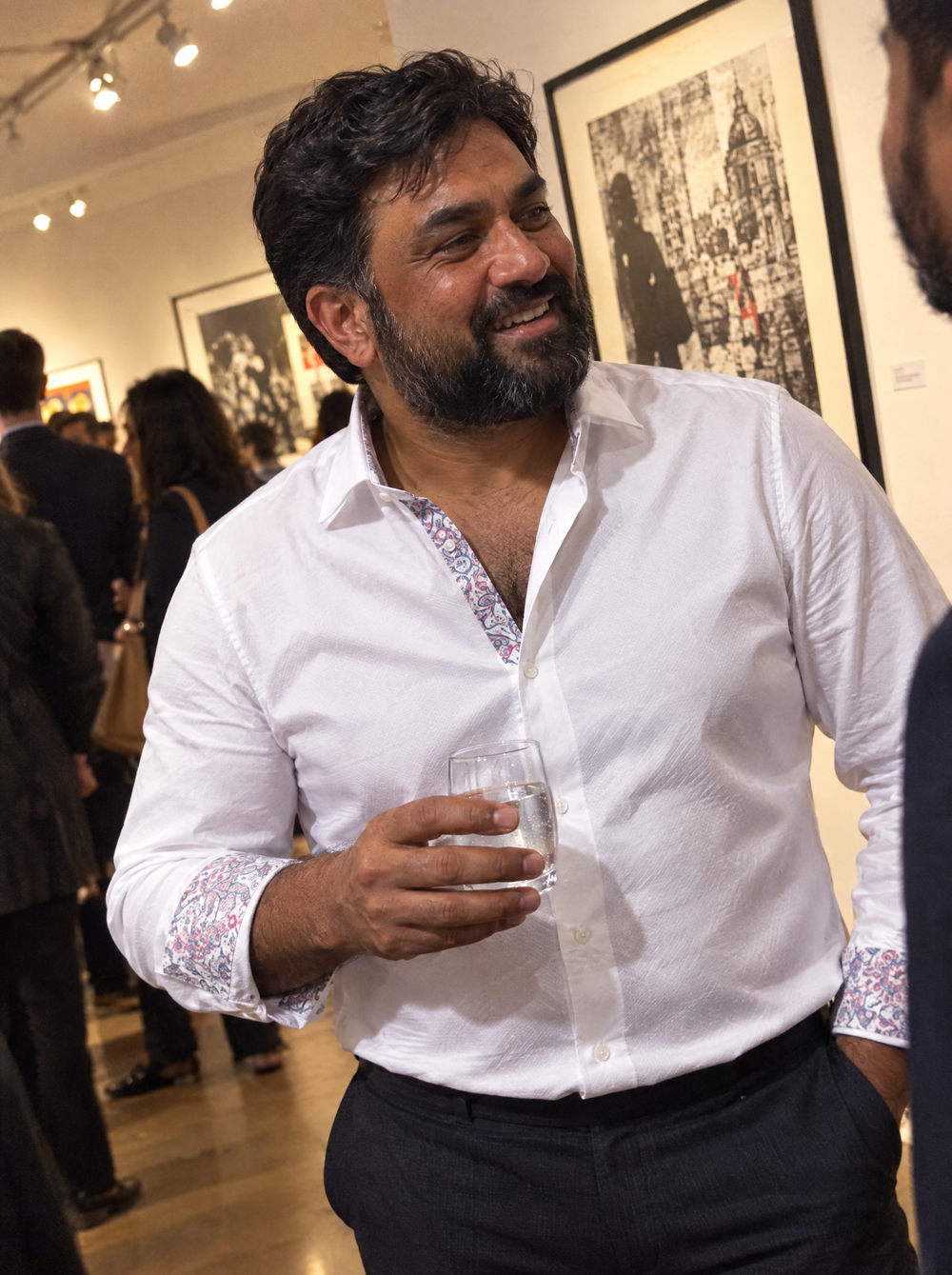 Man wearing the White Textured shirt with Persian Paisley Accents at a gallery opening