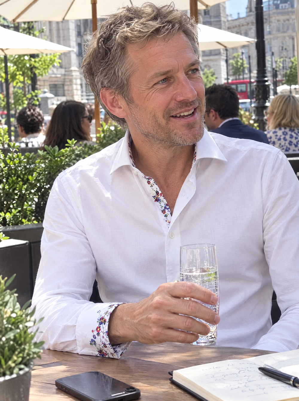 Man wearing the White Sateen Shirt with Botanical Sakura Accents at a business lunch