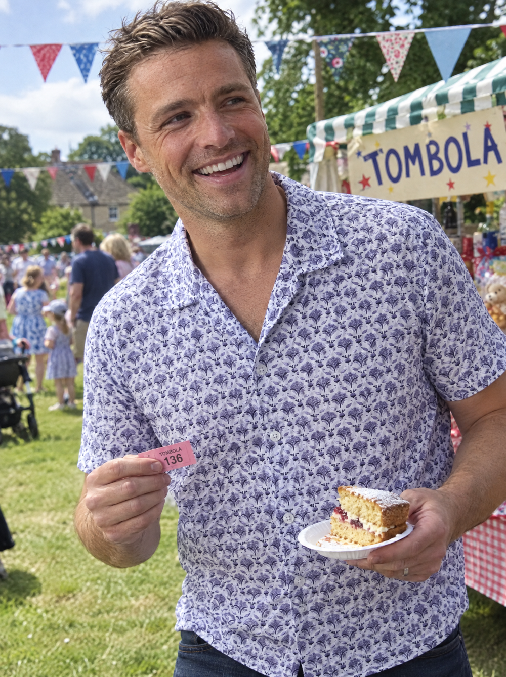 Man wearing the Blue Geo Flora Open Collar shirt at a village fête