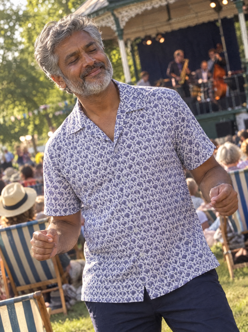 Man wearing the Blue Geo Flora Open Collar shirt at an outdoor jazz festival