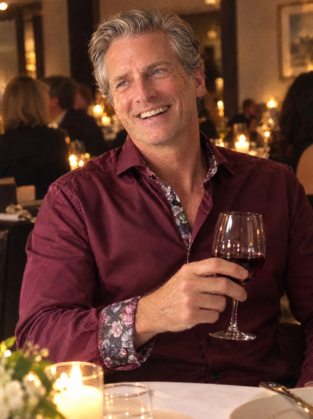 Man wearing the Burgundy Sateen shirt with Roses Accents at an anniversary dinner