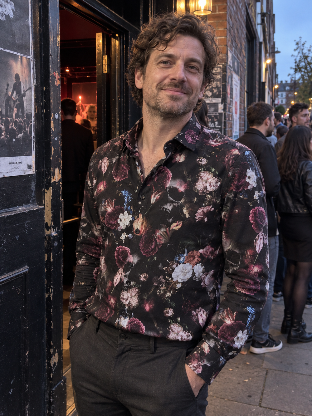 Man wearing the Dark Bloom Shirt outside a music venue