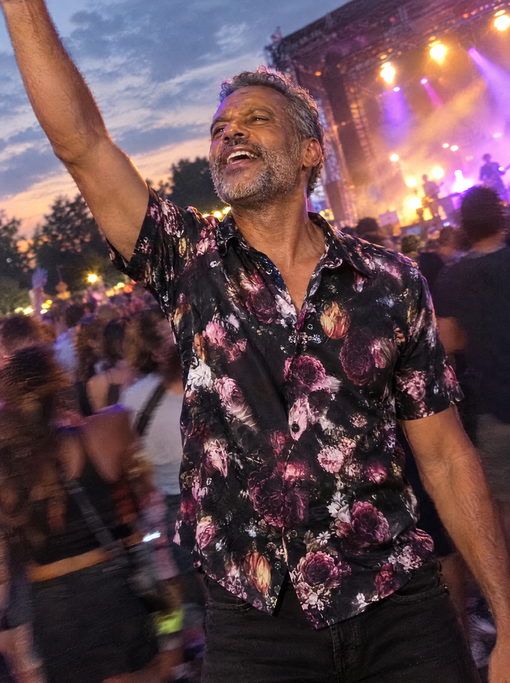 Man wearing the Dark Bloom Short Sleeve shirt at an outdoor gig