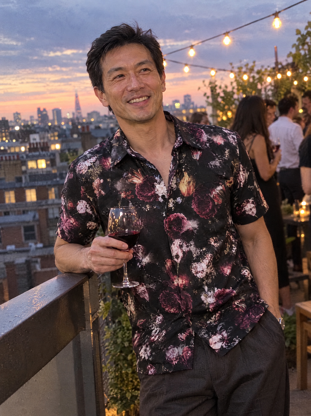Man wearing the Dark Bloom Short Sleeve shirt on a rooftop terrace