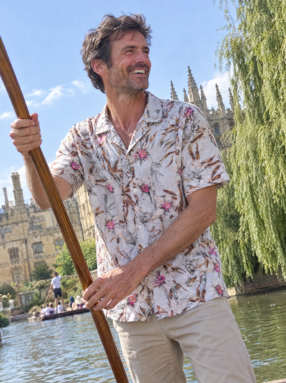 Man wearing the Edenic Bamboo Linen Short Sleeve shirt punting on the river