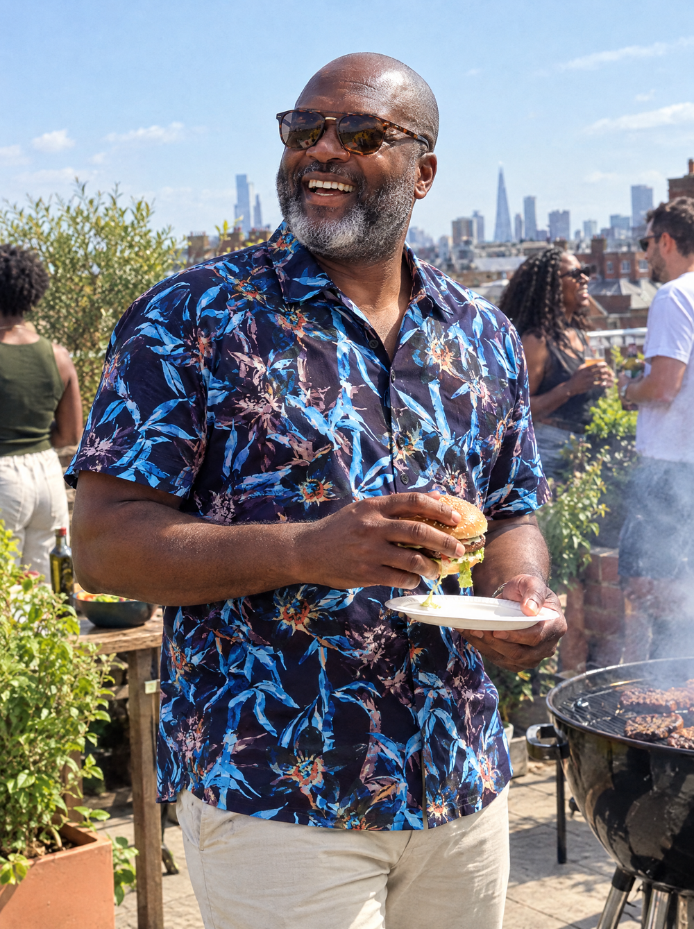 Man wearing the Electric Bamboo Short Sleeve Shirt at a rooftop barbecue