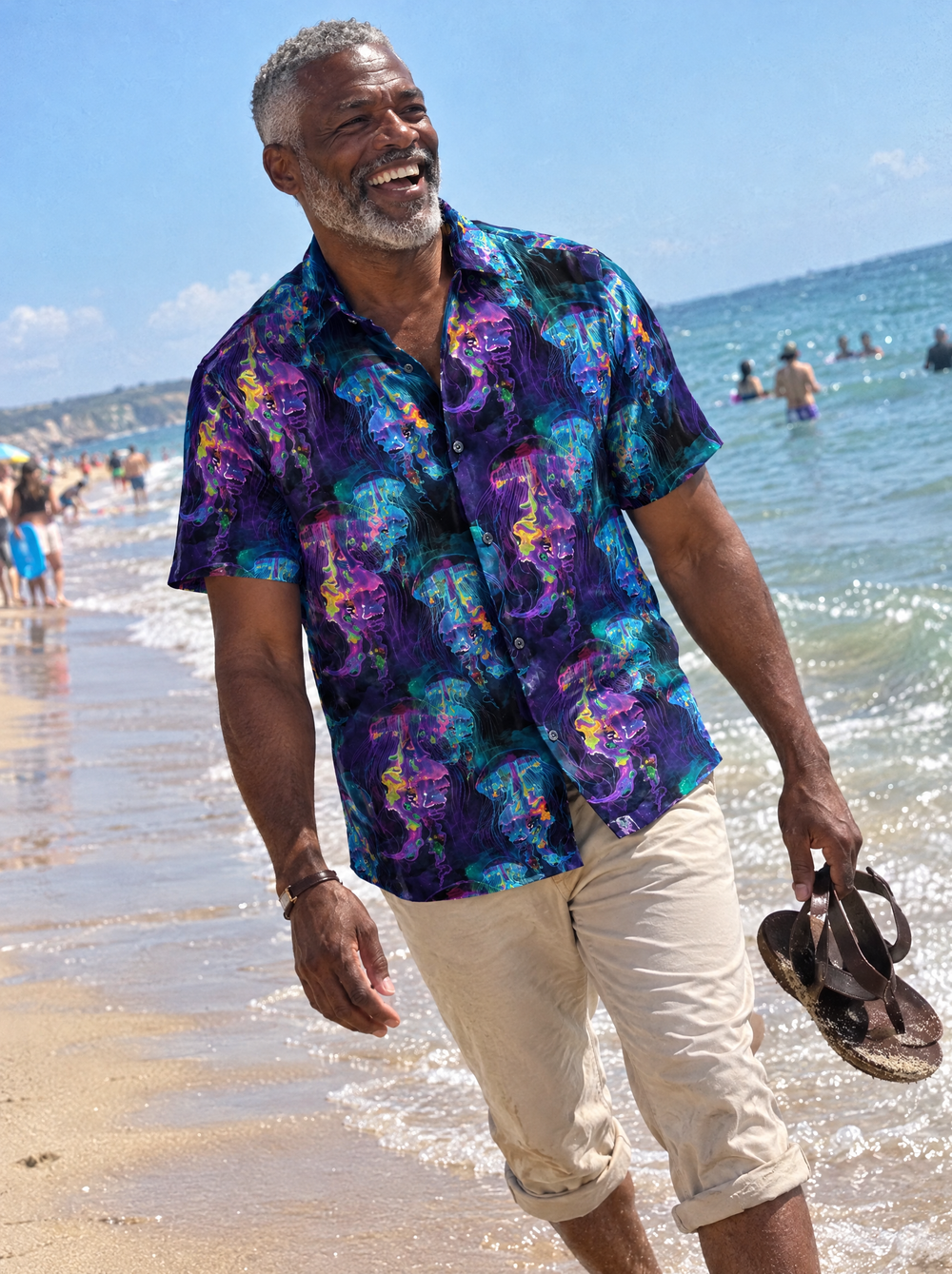 Man wearing the Electric Jellyfish Short Sleeve shirt on a beach
