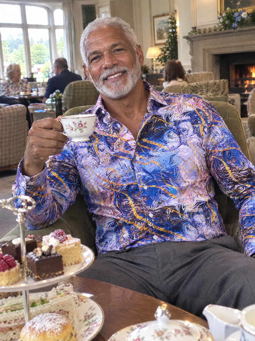Man wearing the Goldenstone shirt at afternoon tea