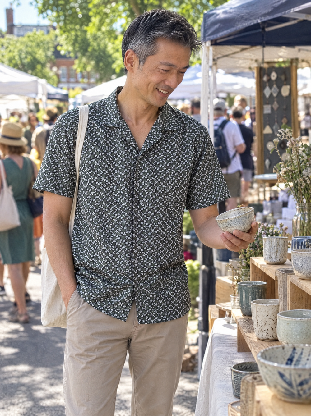 Man wearing the Green Botanic Geo Open Collar shirt at a makers' market