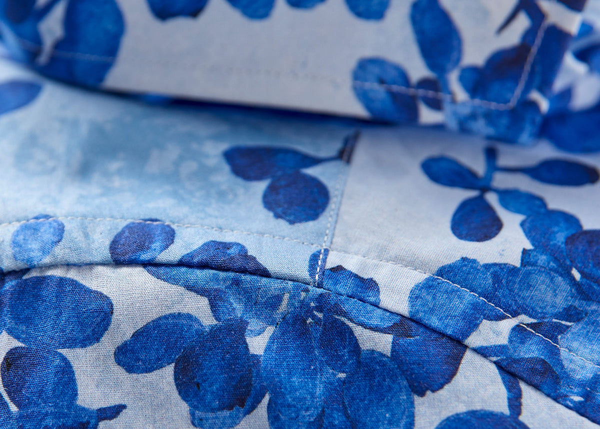 Sleeve seam in blue floral shirt fabric