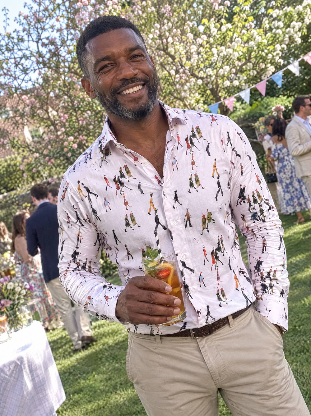 Man wearing the Lowry: Going To Work (Pink) shirt at a garden party