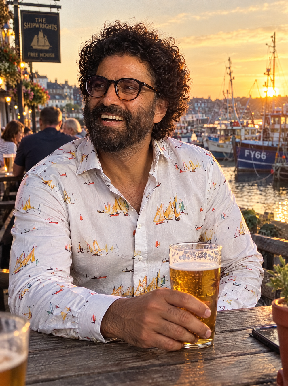 Man wearing the Lowry Yachts shirt at a harbourside pub