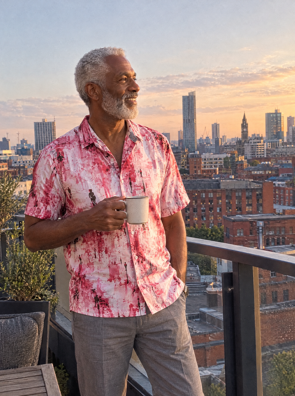Man wearing the Manchester Dawn Short Sleeve shirt on a Manchester rooftop