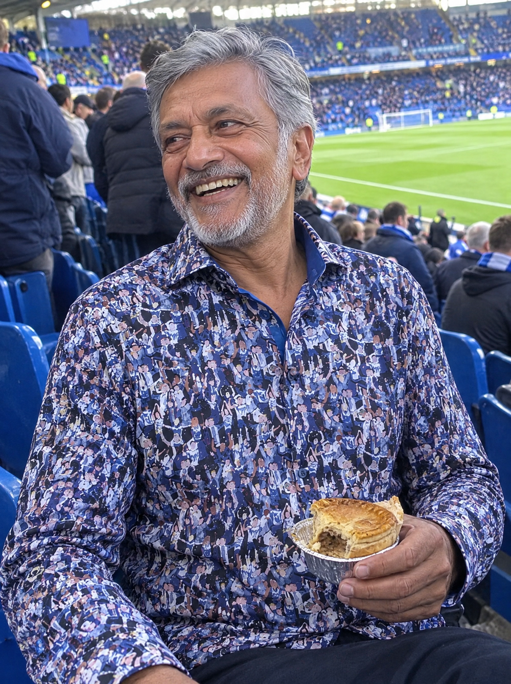 Man wearing the Matchday (Blue) Shirt in the stands