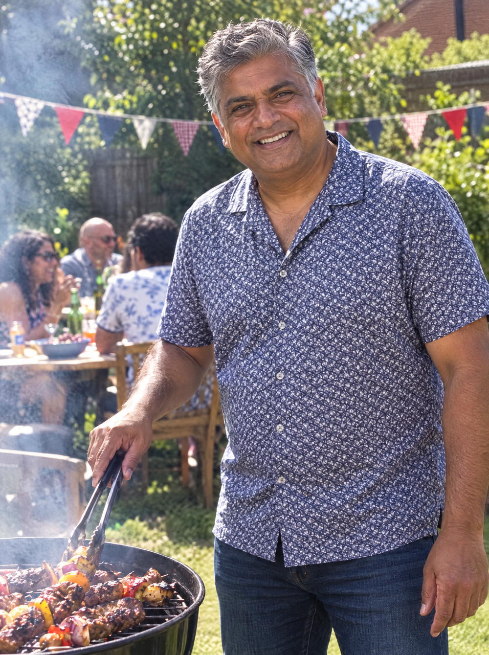 Man wearing the Navy Botanic Geo Open Collar shirt at a garden barbecue