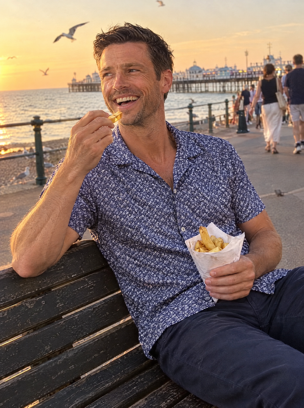 Man wearing the Navy Botanic Geo Open Collar shirt on the seafront