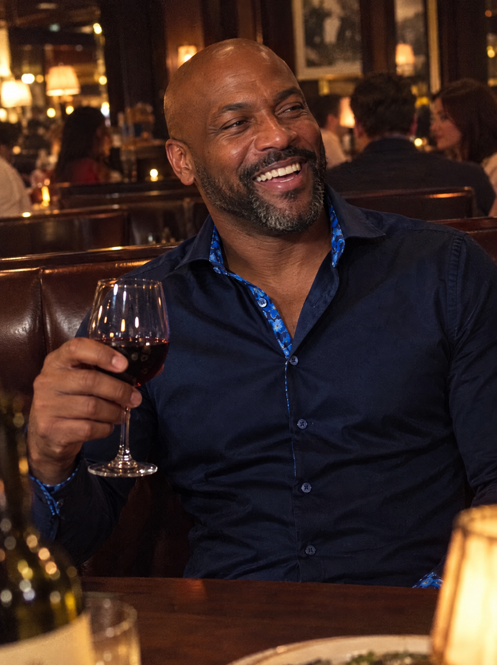 Man wearing the Navy Sateen shirt with Flowers Under Moonlight Accents in a steakhouse
