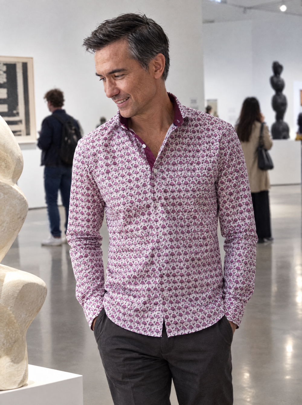 Man wearing the Pink Geo Flora shirt in a design museum