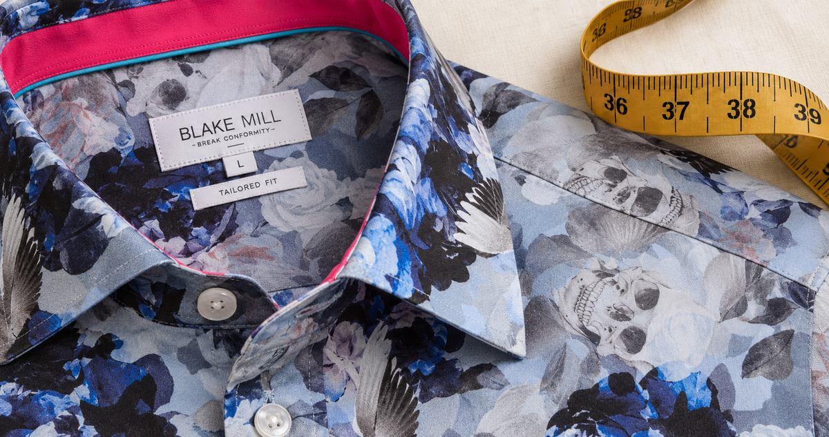 Close-up of a floral shirt collar beside a measuring tape