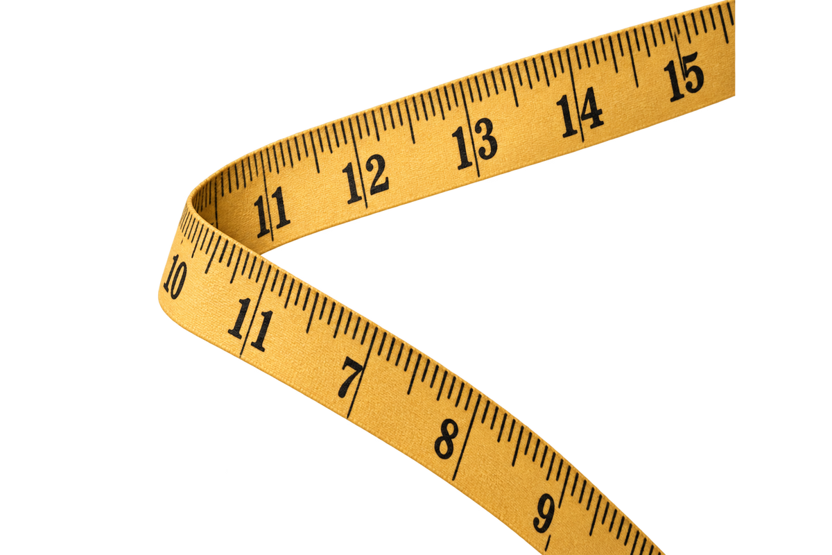 A yellow fabric measuring tape with black printed inch markings, shown curved on a plain white background.