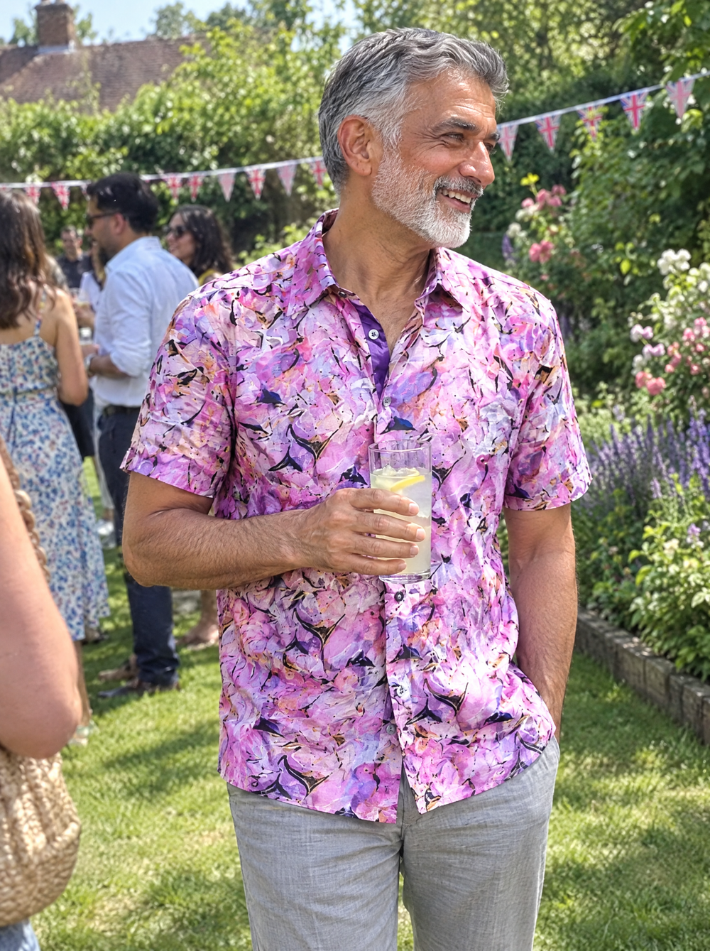 Man wearing the Violet Haze Short Sleeve shirt at a garden party