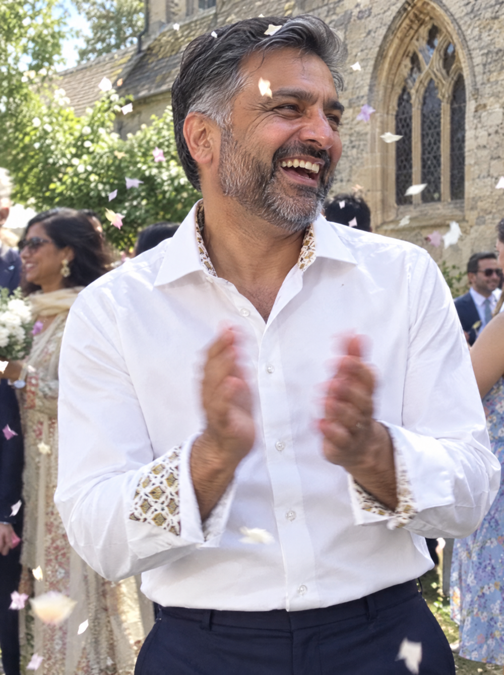 Man wearing the White Sateen shirt with Yellow Flora Accents at a summer wedding