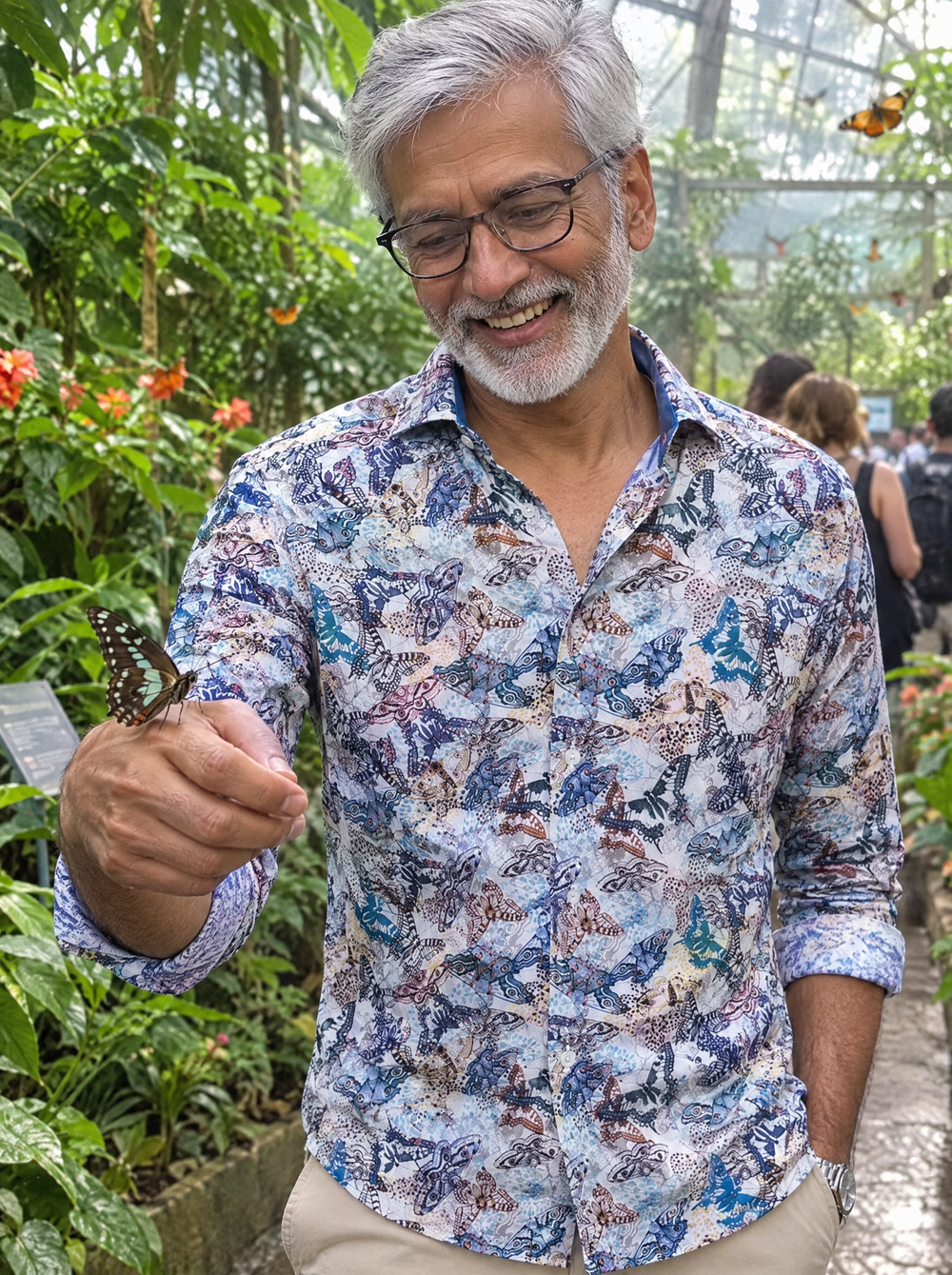 Man wearing the Wings Of A Butterfly shirt in a butterfly house