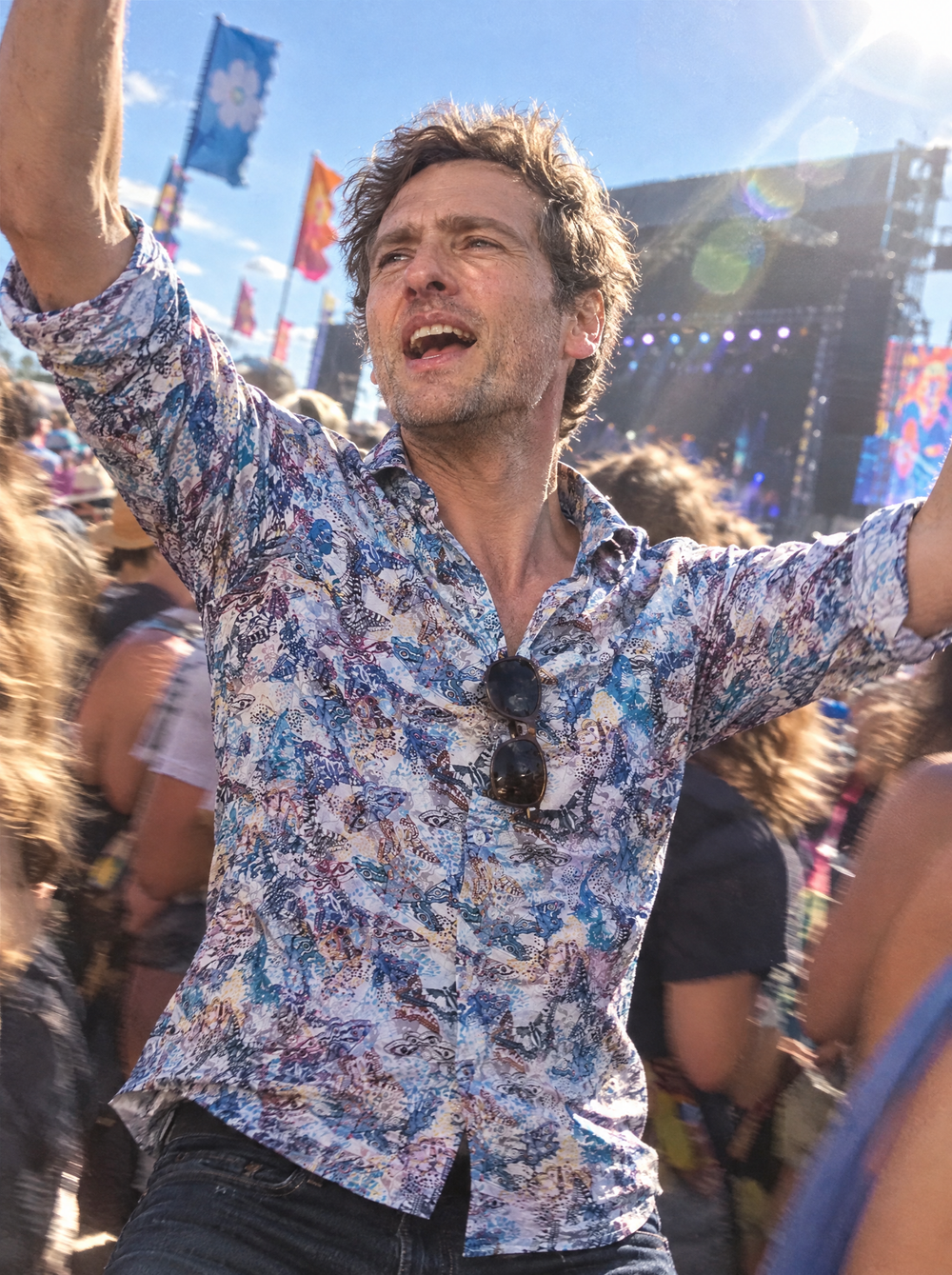Man wearing the Wings Of A Butterfly shirt at a music festival