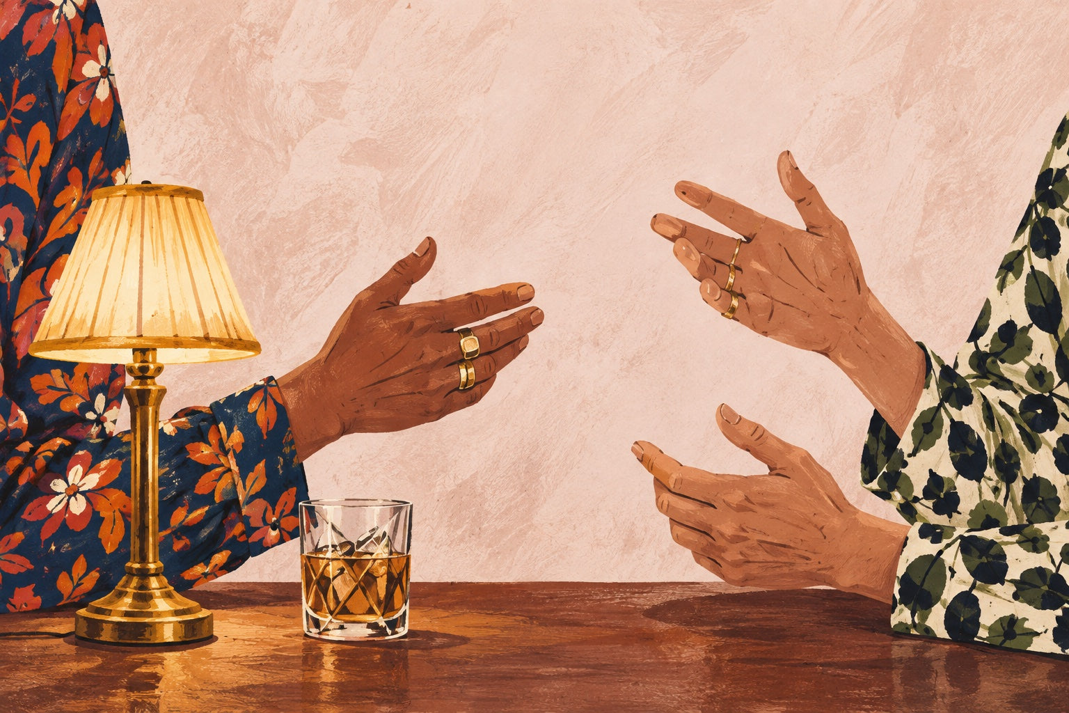 Expressive hands in patterned shirt sleeves sharing ideas across a table.